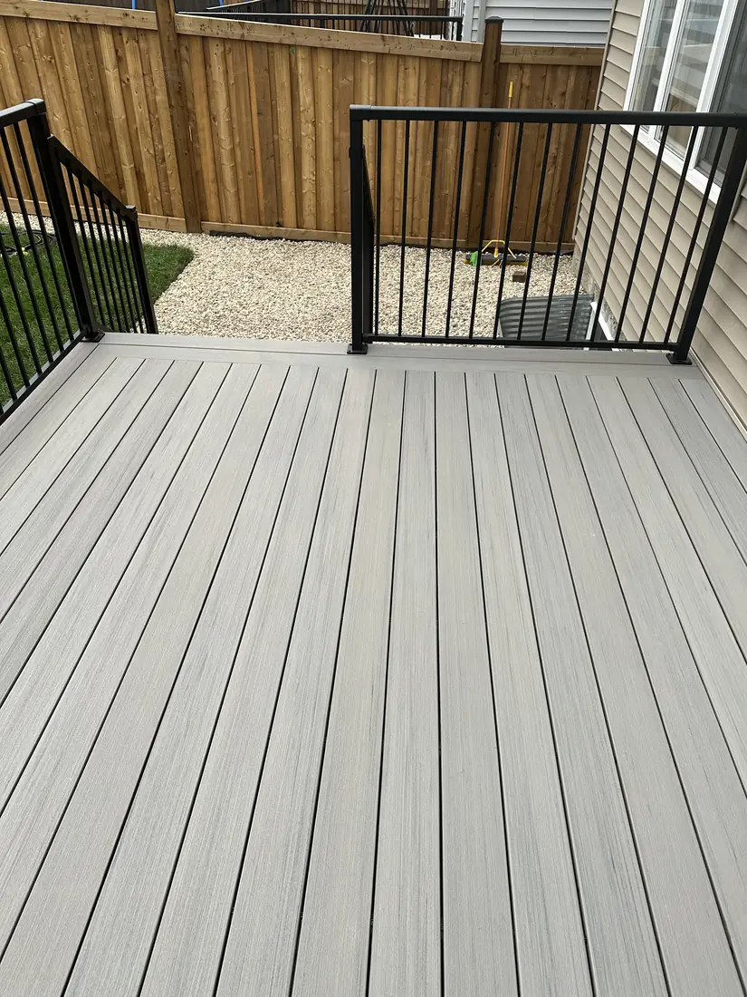 TimberTech Sea Salt Gray composite deck boards with consistent gapping and black aluminum railing, built in Edmonton by TrueBlue Builders